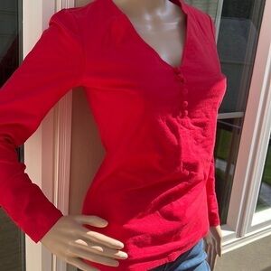 Red pull over V-neck top with long sleeves and covered buttons